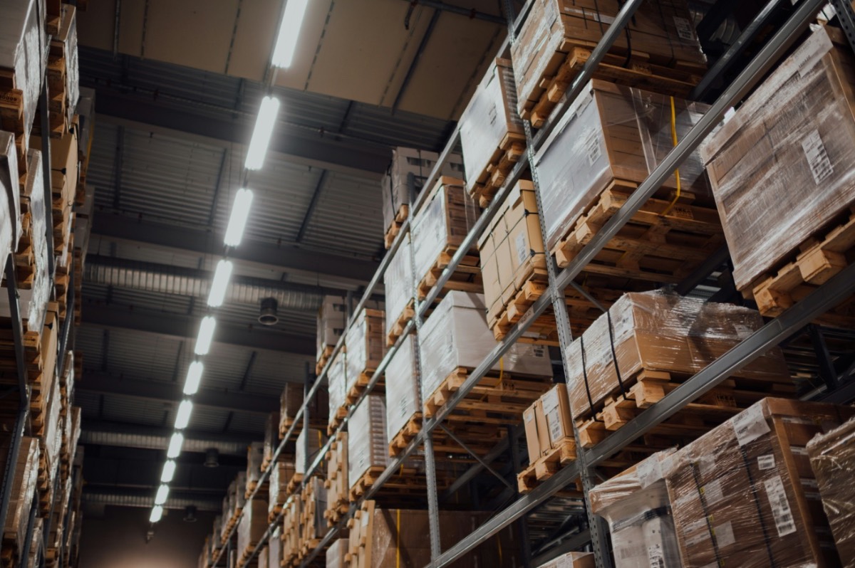 Warehouse aisle with stacked pallets